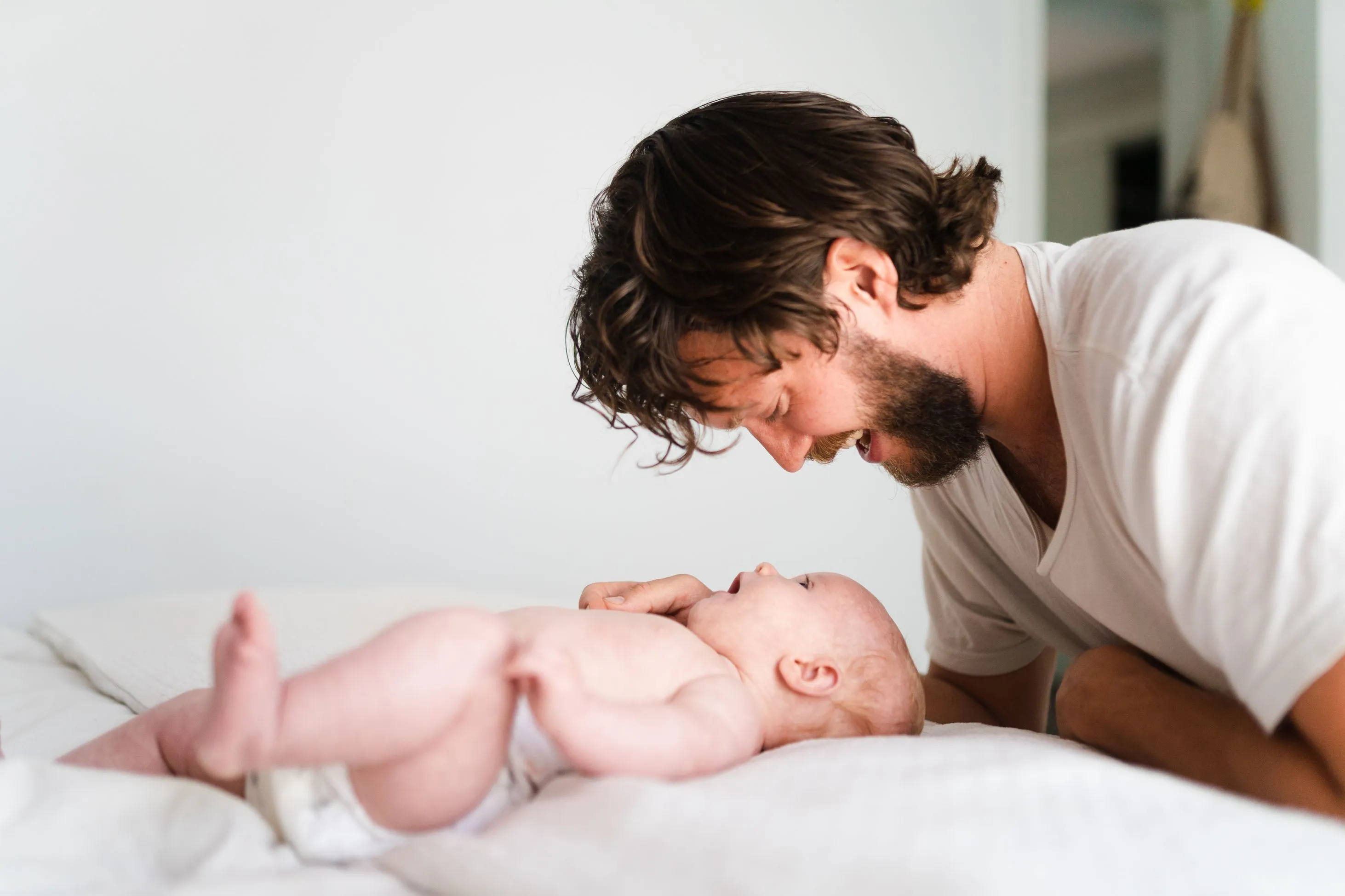 Father bonding with infant =